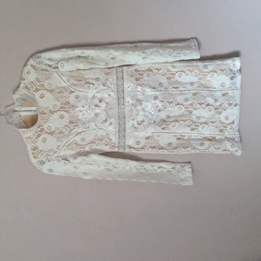 Never worn, very beautiful white lace dress with nude underlayer